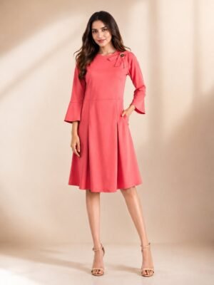 Women's coral pink solid A-line partywear dress with bow and floral brooch