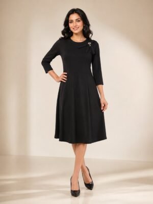 Women's black partywear dress with bow and pearl detail
